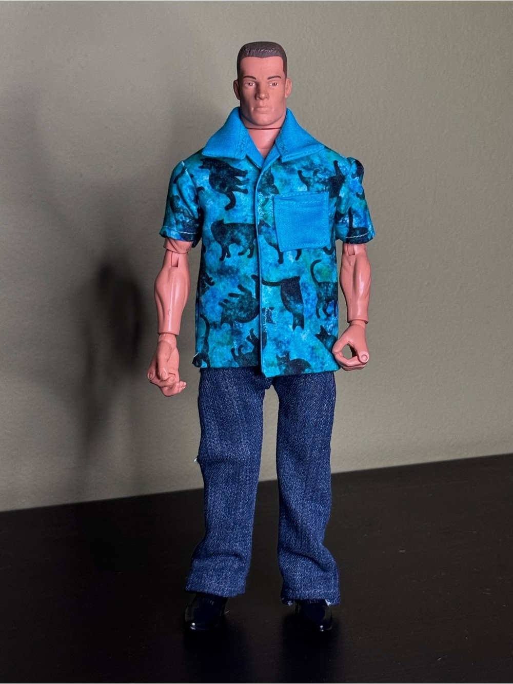 Cosmo Cat themed doll shirt with blue collar and pocket